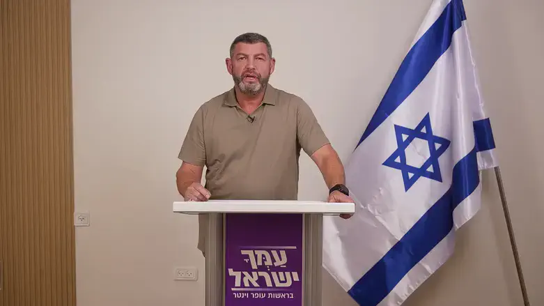Ofer Winter and a New Generation of Israeli Right-Wing Politics: Inside Amcha Israel’s Leadership Experiment Ofer Winter speaking at a podium next to an Israeli flag