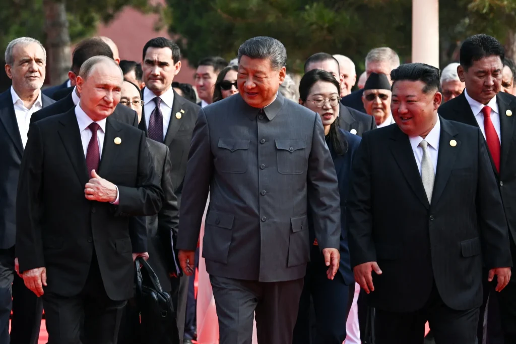 Kim Jong Un Becomes the World’s Most Sought-After Meeting as Trump, Seoul and Tokyo Vie for Access Vladimir Putin, Xi Jinping and Kim Jong Un walk together alongside other officials